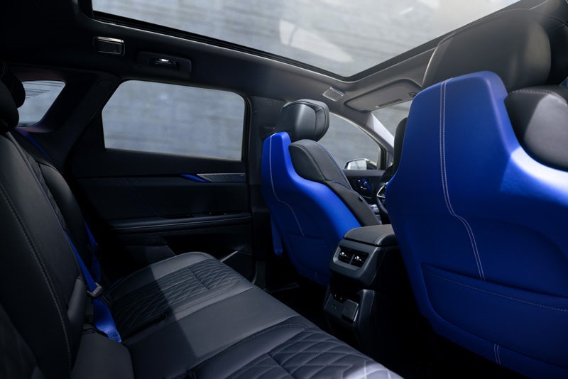 Back Seat View of the 2026 OPTIQ-V Blue Front Seats, Sun Roof, and Interior | Earnhardt Chandler Cadillac in Chandler AZ